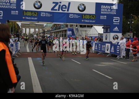 Berlin, Germany. 23rd September 2017. Skaters cross the finishing line. Over 5,500 skater took part in the 2017 BMW Berlin Marathon Inline skating race, a day ahead of the  Marathon race. Bart Swings from Belgium won the race in 58:42 for the 5th year in a row. Credit: Michael Debets/Alamy Live News
