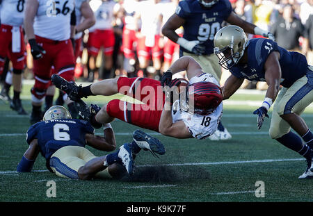 Annapolis, Maryland, USA. 23rd Sep, 2017. Cincinnati Bearcats TE #18 Tyler Cogswell is upended during a NCAA football game between the United States Naval Academy Midshipmen and the Cincinnati Bearcats at Navy Marine Corp Stadium in Annapolis, Maryland. Justin Cooper/CSM/Alamy Live News Stock Photo