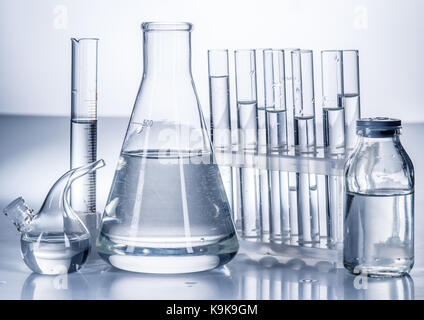 Different laboratory beakers and glassware. Monochrome. Stock Photo