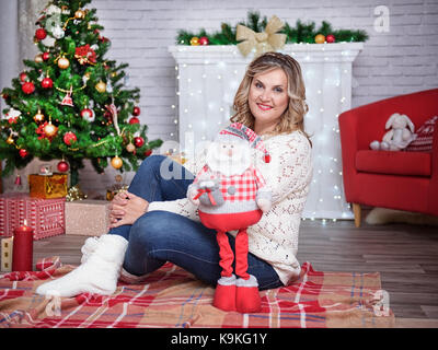 Beautiful young woman on the background of a New Year's background. Christmas night Stock Photo