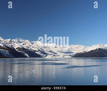 At the end of College Fjord in Alaska is Prince William Sound, surrounded by tidewater glaciers extending down out of the Chugach mountain range. Stock Photo