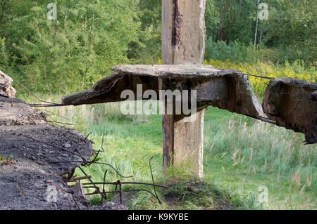 Dangerous damaged concrete construction. The Second World War ruins. Stock Photo