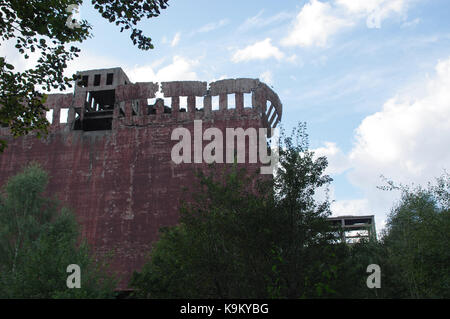 Dangerous damaged concrete construction. The Second World War ruins. Stock Photo