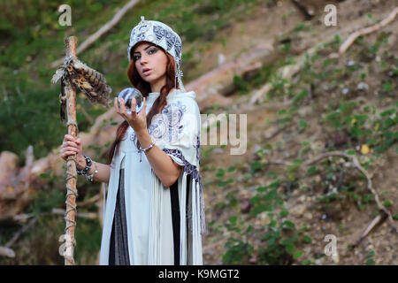 Shaman with Staff and glass ball outdoor Stock Photo