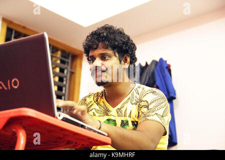 Young man using laptop Stock Photo