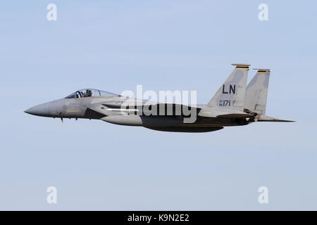 USAF F-15C Eagle from the 493rd Fighter Squadron accelerating away after a approach into it's home base at RAF Lakenheath. Stock Photo