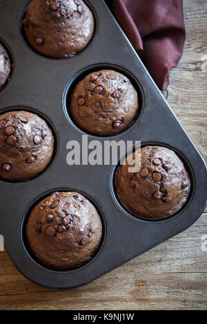 Chocolate Muffins with Chocolate Drops. Homemade chocolate pastry for breakfast or dessert. Stock Photo