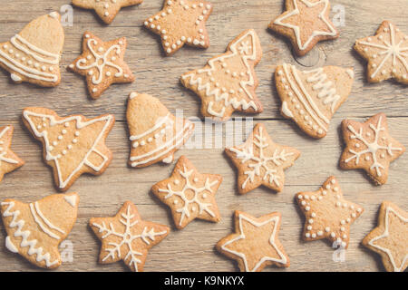 Christmas gingerbread cookies on wooden table - Christmas homemade festive bakery Stock Photo