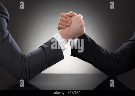 Close-up Of A Two Businessman Competing In Arm Wrestling Stock Photo
