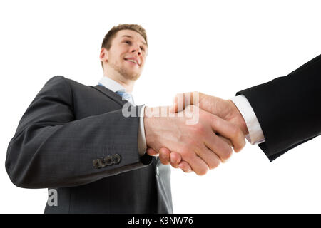 Low Angle View Of Two Businessman Shaking Hand Stock Photo