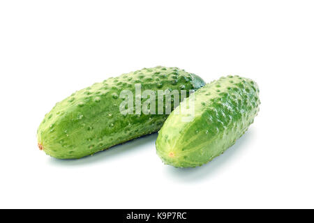 Two fresh cucumbers on white Stock Photo