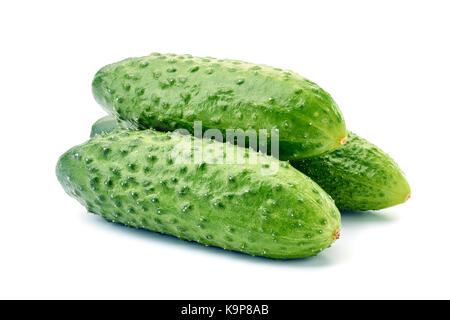 Three fresh cucumbers on white Stock Photo