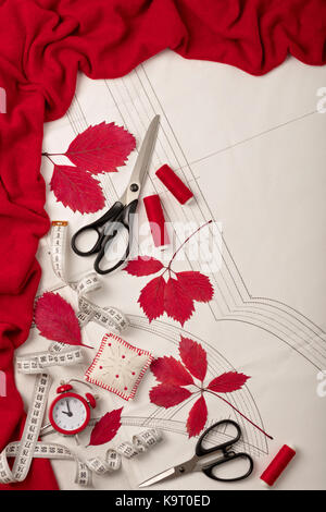 All for sewing - fabric, patterns and sewing accessories. Fashionable autumn colors. Trend of the season - colors Grenadine and Flame scarlet. Flat la Stock Photo