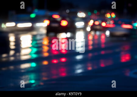 blurred motion. car traffic in the evening on wet road. Stock Photo
