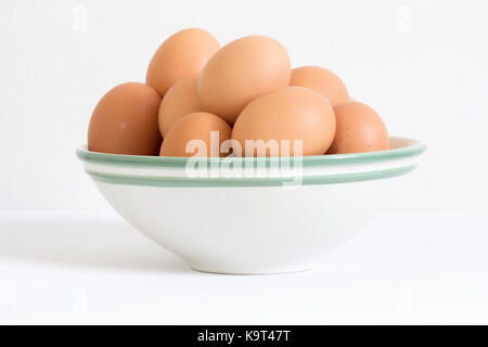 raw eggs in white bowl Stock Photo
