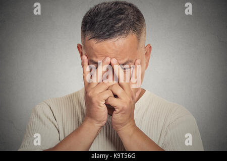 Young man with depressed face expression Stock Photo