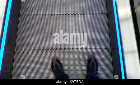 Moving escalator in shopping mall in Monaco Stock Photo