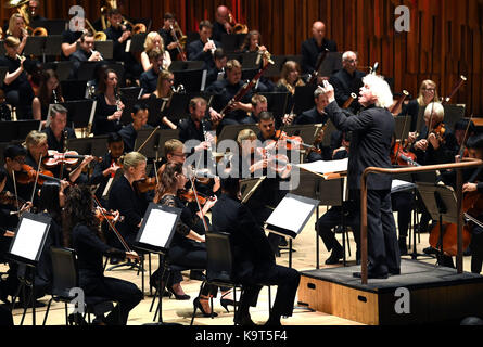 Sir Simon Rattle conducts 11-18-year-old musicians from east London on the closing day of ÔThis is Rattle', at the Barbican in London. PRESS ASSOCIATION. Picture date: Sunday September 24, 2017. The 54 young people perform with LSO players and musicians from the Guildhall School, all playing side-by-side on the Barbican stage, performing music from Elgar's ÔEnigma Variations' and Stravinsky's ÔThe Rite of Spring'. The performance is part of the ÔLSO On Track' programme, which has seen LSO players work with thousands of young people from east London since 2008, in activities