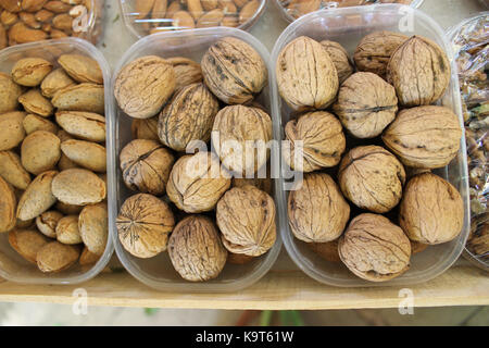 Walnuts and Almonds in plastic boxes. Market in Aix-En-Provence Stock Photo
