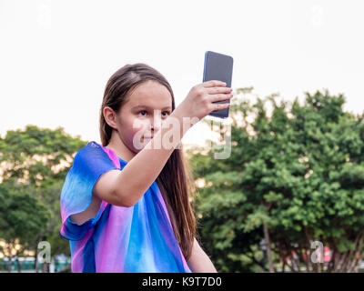 Young girl taking a selfie with a smartphone Stock Photo