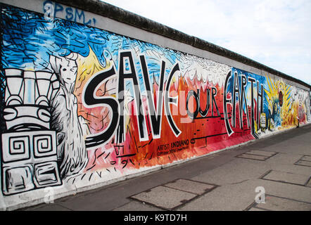 The East Side Gallery's murales are the street-art in Berlin, painted on their own famous wall Stock Photo