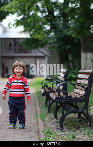 boy kid bench parl alone Stock Photo