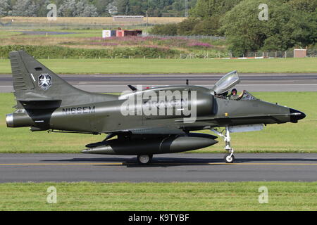 N166EM, a Douglas A-4N Skyhawk operated by Draken International's Aggressor Squadron, at Glasgow Prestwick Airport in Ayrshire. Stock Photo