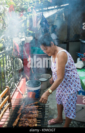 Cooking food - at home in asia, day outdoor makeshift Stock Photo