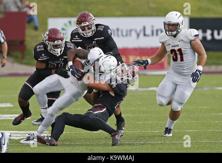 Las Cruces, NM, USA. 23rd Sep, 2017. UTEP running back Quardraiz Wadley is sacked by New Mexico State defensive back Ron LaForce during the first half of an NCAA college football game in Las Cruces, N.M., Saturday, Sep. 23, 2017. Credit: Andres Leighton/Albuquerque Journal/ZUMA Wire/Alamy Live News Stock Photo