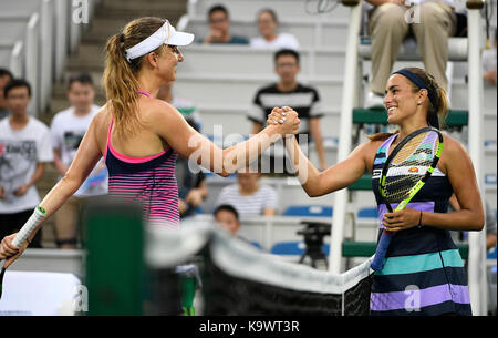 Wuhan, China. 24th September, 2017.  Monica Puig (R) of Puerto Rico shakes hands with Mona Barthel of Germany after their singles' first round match at 2017 WTA Wuhan Open in Wuhan, capital of central China's Hubei Province, on Sept. 24, 2017. Monica Puig won 2-1. (Xinhua/Wang Peng)(wdz) Stock Photo