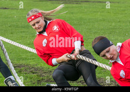 Teamwork, rope challenge, sporting event at Southport, Merseyside, UK  24th September, 2017. team at the European Outdoor Tug of War Championships and 2017 World Junior and Under 23 Championships held at Carr Lane, Southport. The European Championships include four weight classes for mens tug of war teams and two weight classes for ladies tug of war teams, and include a mixed weight class with the teams competing consisting of four men and four women. Teams have a maximum weight limit of 600 kilos in these events. Stock Photo