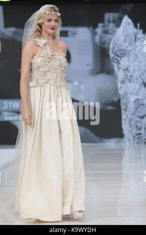 London, UK. 24th Sep, 2017. London Olympia staging the National Wedding Show with a show-stopping Catwalk, The Runway show is the flagship feature of the event and showcases a selection of dresses from top designers to highstreet names.Paul Quezada-Neiman/Alamy Live News Credit: Paul Quezada-Neiman/Alamy Live News Stock Photo