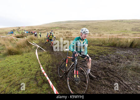 55th Annual 3 Peaks Cyclo-Cross, Ingleton Yorkshire Dales,  UK. 24th September 2017. Andrew Fletcher from Skipton Cyclying Club tackles the mud as he descends Inglebrough on a specialist cyclo-cross bike. The winner from more than 570 riders completed the 38 mile course in 3 hours and 6 minutes. Credit: Andy Ward/Alamy Live News Stock Photo