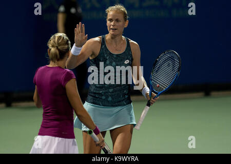 Wuhan, China. 24th September, 2017. Anna-Lena Groenefeld (R) of Germany celebrates with Kveta Peschke of the Czech Republic during the doubles' first round match against Olga Savchuk of Ukraine and Katarina Srebotnik of Slovenia at 2017 WTA Wuhan Open in Wuhan, capital of central China's Hubei Province, on Sept. 24, 2017. Anna-Lena Groenefeld and Kveta Peschke won 2-1. (Xinhua/Zhang Duan)(wll) Stock Photo