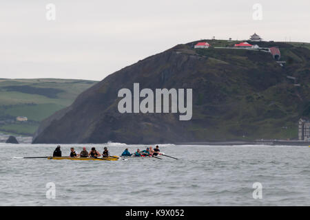 Aberystwyth, Ceredigion, Wales, UK 24th September 2017. UK Weather: Competitors in Aberystwyth rowing regatta endured high swells with a mixture of rain and dry conditions as they competed the course along Cardigan Bay just off Aberystwyth. © Ian Jones/Alamy Live News. Stock Photo