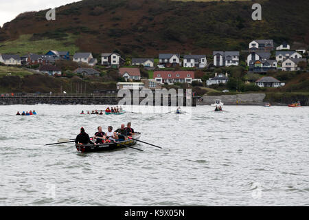 Aberystwyth, Ceredigion, Wales, UK 24th September 2017. UK Weather: Competitors in Aberystwyth rowing regatta endured high swells with a mixture of rain and dry conditions as they competed the course along Cardigan Bay just off Aberystwyth. © Ian Jones/Alamy Live News. Stock Photo