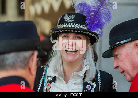 London, UK. 24th September, 2017. Sharing a joke with Chelsea Pensioners - The annual Harvest Festival organised by the Pearly Society starts with a ceremony in Guild hall courtyard and then processes to Bow Church in the City of London. Pearly Kings and Queens of London get together for the biggest event in the Pearly calendar. London 24 Sep 2017. Credit: Guy Bell/Alamy Live News Stock Photo