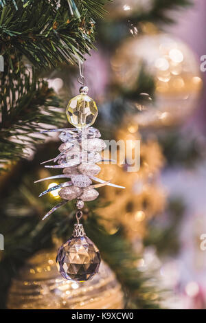 Beautiful shiny New Year decorations on Christmas tree Stock Photo