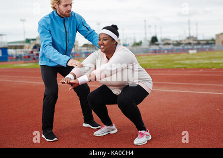 Exercising on stadium Stock Photo