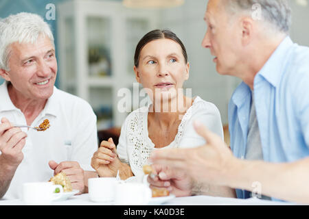 Mature friends talking Stock Photo
