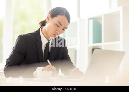 Handsome Businessman at Workplace Stock Photo