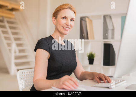Waist-up Portrait of Smiling Entrepreneur Stock Photo