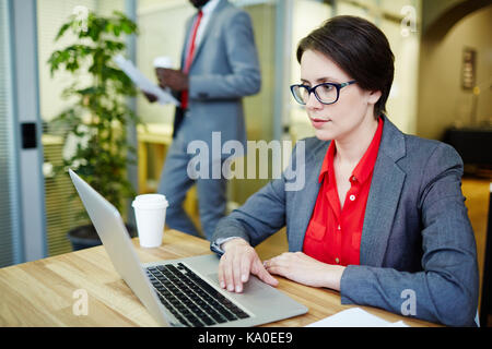 Pretty Manager Wrapped up in Work Stock Photo