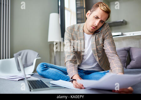 Freelance Worker Using Smartphone Stock Photo