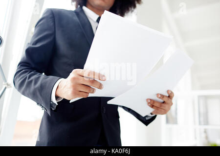 Studying Documents at Modern Office Stock Photo