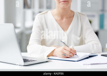 Young Businesswoman Wrapped up in Work Stock Photo