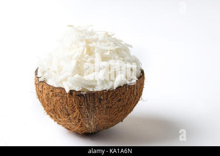 Grated coconut in a natural shell as bowl Stock Photo