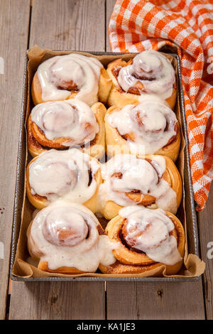 Fresh Sweet Homemade Cinnamon Rolls in baking pan Stock Photo