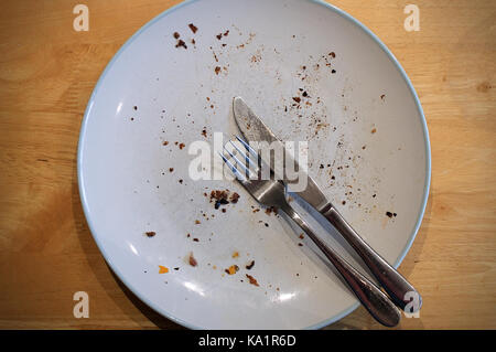 An empty plate after a meal Stock Photo
