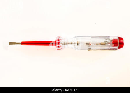 Screwdriver with Voltage Tester Electrical Tester isolated on a white background. Stock Photo